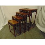 A 20th century quartetto of Chinese hardwood nesting tables of rectangular form with foliate