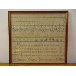 A framed and glazed sampler by Frances Wright Covenham, aged 10 years March 1856, 41 x 45cm