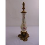 A 19th century continental porcelain lamp base with ormolu mounts converted to electricity