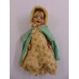A Victorian bisque headed doll in original clothing