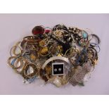 A quantity of costume jewellery to include necklaces, bracelets, rings and brooches