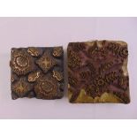 A pair of wooden printing blocks carved with naturalistic forms