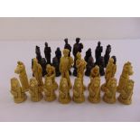 A composition chess set in the form of classical figurines