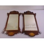 A pair of Edwardian rectangular wooden framed mirrors in late 18th century style