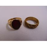 A 9ct yellow gold signet ring set with a cornelian approx total weight 5.3g and a gold plated band