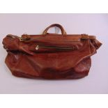 A mid 20th century brown leather Gladstone style bag