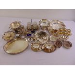A quantity of silver plate to include a punch bowl, trays, fruit dishes, condiments, coasters and
