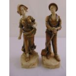 A pair of continental ceramic figurines of a farm boy and girl on naturalistic plinths