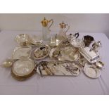 A quantity of silver plate to include platters, dishes, a gilt mounted claret jug and entrée dish