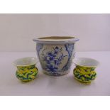 A blue and white jardinière and a pair of Chinese yellow and blue vases with character marks to