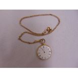 14ct yellow gold open face pocket watch with white enamel dial and Roman numerals on 14ct gold