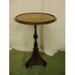 An Edwardian circular mahogany inlaid side table, the knopped stem on triform support