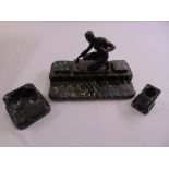 An Art Deco bronze and green marble three piece desk set supported by a classical figure