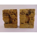 A pair of rectangular soapstone bookends carved with flowers and vases in the oriental style