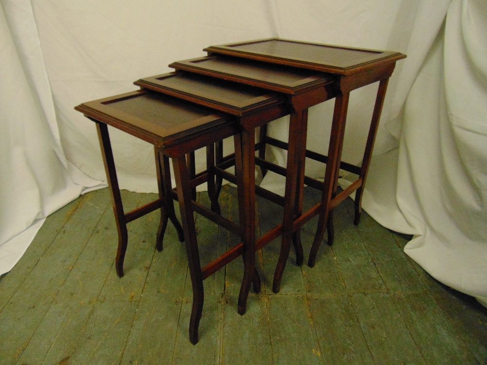 Carl Hiess a nest of four rectangular mahogany tables