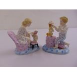 A pair of porcelain figurines of a boy and girl, anchor mark to the base