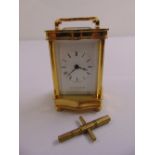A Mappin and Webb miniature carriage clock, white enamel dial with Roman numerals and key