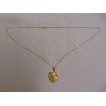 9ct yellow gold locket on a 9ct yellow gold chain, approx total weight 5.1g