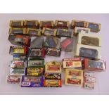 A quantity of diecast to include cars and buses, all in original packaging (33)