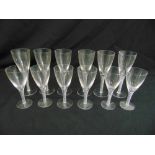 A set of twelve wine glasses with white air twist stems