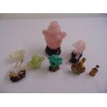 A quantity of carved oriental semi precious stone vases, scent bottles, figurines and carved