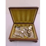 A quantity of mixed flatware to include hallmarked silver spoons in hinged wooden case