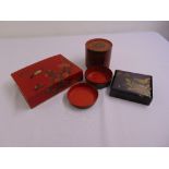 Three Oriental lacquered boxes one containing two dishes