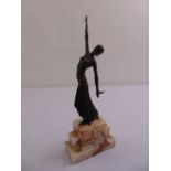A bronze figurine of a 1930s flapper on marble plinth