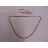 A 9ct yellow gold necklace and a 9ct gold tie pin, approx total weight 22.3g