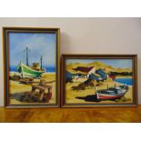 Robert Guis two framed oils on canvas of fishing boats moored on a beach, signed, 41.5 x 27.5cm