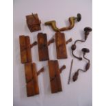 A quantity of antique woodworking tools to include planes and drills (8)