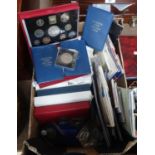 A boxful of sets of British coins