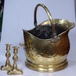 A brass coal bucket, and a pair of candlesticks