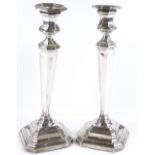 A pair of silver octagonal tapered candlesticks, by James Deakin & Sons, hallmarks Sheffield 1913,