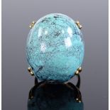 A large Vintage 1970s cabochon turquoise egg ring, with chased 18ct gold settings, setting height
