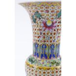 A Chinese porcelain narrow-necked vase, hand painted enamel floral decoration on geometric ground,