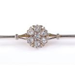 An 18ct gold diamond cluster bar brooch, total diamond content approx 0.5ct, brooch length 67.5mm,