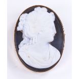 A relief carved agate cameo brooch, depicting Classical female portrait, in unmarked yellow metal