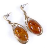 A pair of unmarked gold and Baltic amber pendant earrings, height excluding fitting, 29.8mm, 5.2g