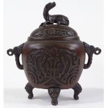 A Chinese patinated bronze censor, with relief cast decoration, height 15cm