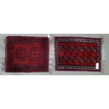 2 small red ground Bokhara rugs, largest 3' 2" x 2' 3" (2)