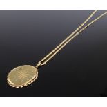 A 9ct gold oval pendant necklace, on 9ct curb link chain, pendant height 36.1mm, chain length 510mm,