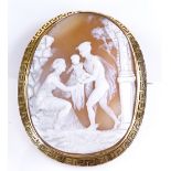 A relief carved cameo brooch, depicting Hermes delivering the baby Bacchus, in unmarked 18ct gold