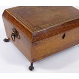 A 19th century rosewood and parquetry inlaid workbox, with brass lion ring handles and paw feet,