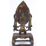 A Chinese verdigris bronze shrine, surmounted by Buddha figures, height 17cm