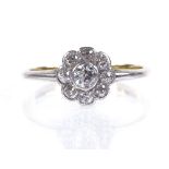 An 18ct gold diamond cluster flowerhead ring, central diamond approx 0.13ct, setting height 7.8mm,
