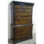 An early 18th century oak chest on chest, with 7 short and 6 long drawers, and corner columns, width