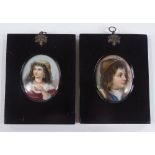 A pair of 19th century painted porcelain plaques, portraits of children, in original ebonised