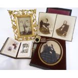 A group of 19th century photographic family portraits, 1 mounted in a 19th century carved giltwood