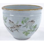 A Chinese porcelain jardiniere with painted bird decoration and text, diameter 23cm, height 18cm